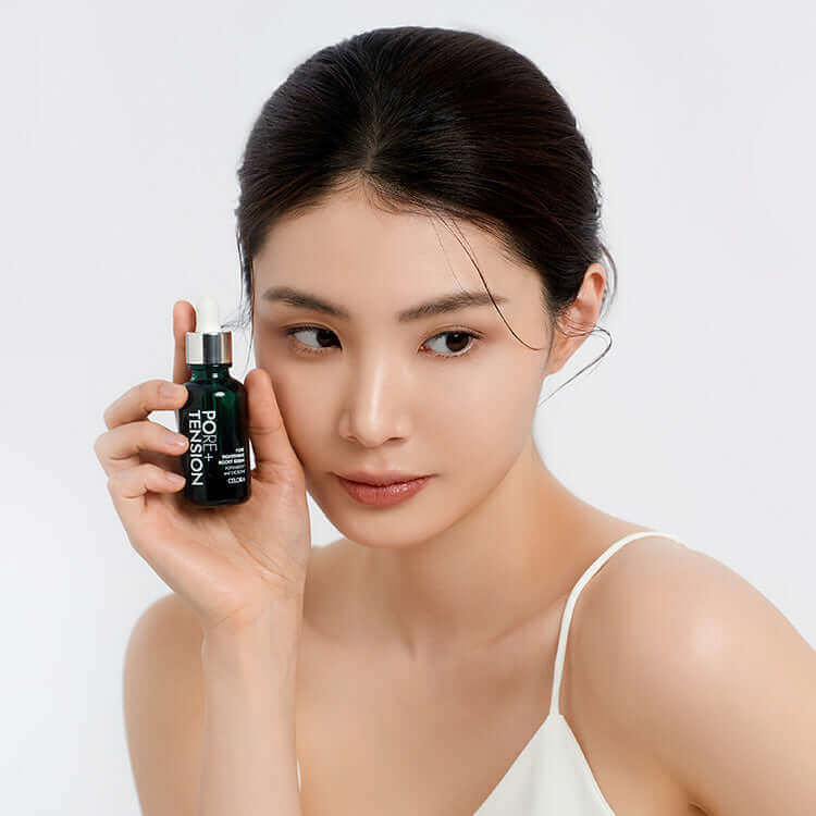 Model holding CELORA.BY POTENSION™ PORE TIGHTENING BOOST SERUM, Skincare Product Display